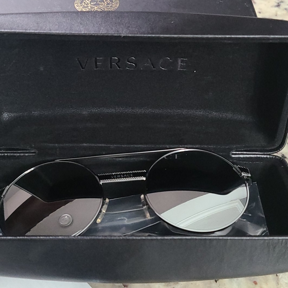 Authentic versace sunglasses new condition.